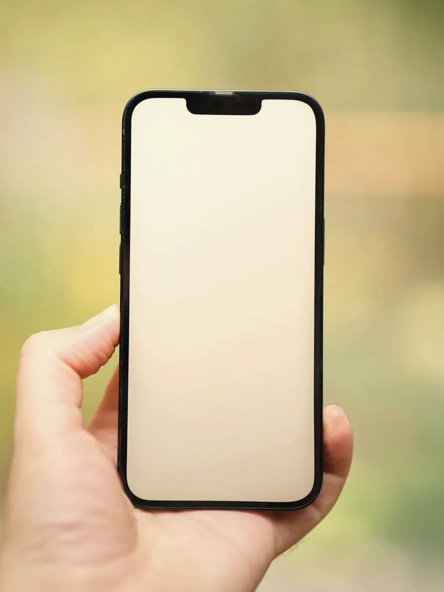 A loan approval on a phone held in one hand